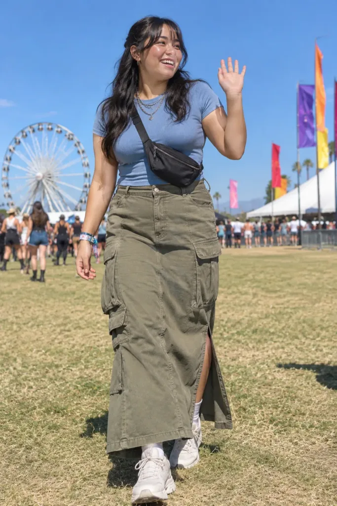 Plus size khaki cargo maxi skirt with blue baby tee and chunky sneakers at a festival